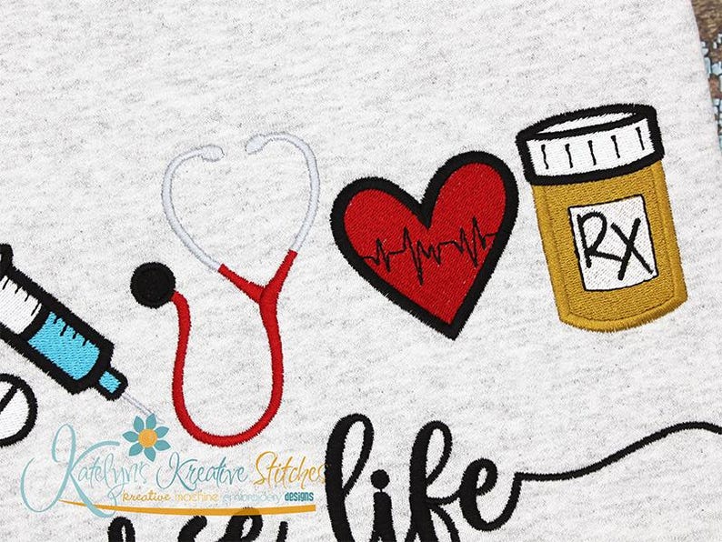 May include: Embroidered design featuring a stethoscope, a heart with a heartbeat line, a pill bottle with an RX symbol, and the text "It's like".