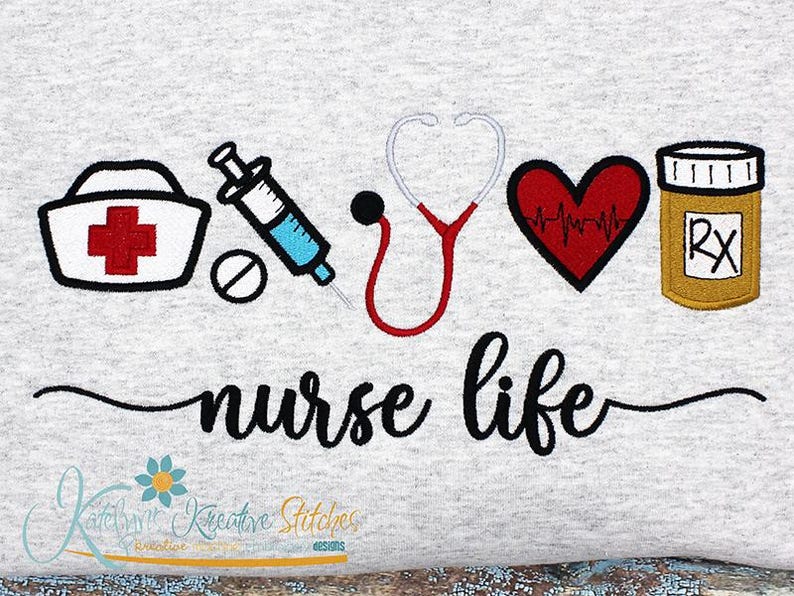 May include: A gray t-shirt with an embroidered design featuring a nurse's cap, a syringe, a stethoscope, a heart with a heartbeat line, a pill bottle with an RX symbol, and the text "nurse life".