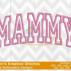 May include: Pink machine embroidery design of the word "MAMMY" in a varsity style font. The design is available in multiple formats, including DST, EXP, HUS, JEF, JEF+, PES, VIP, VP3, and XXX.