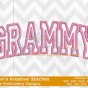 May include: Pink machine embroidery design of the word "GRAMMY" in a varsity style font. The design is outlined in white and has a dotted pattern inside the letters. The design is suitable for embroidery projects.