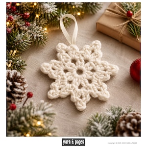 May include: A cream-colored crocheted snowflake ornament featuring a six-pointed star design with an open-work center and a matching fabric loop at the top for hanging. The snowflake is crafted from thick yarn with a textured, knotted appearance.