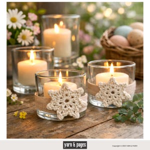 May include: Several lit candles in clear glass holders. Two holders have beige crocheted snowflake accents and burlap ribbon. The candles are on a wooden surface, with flowers and a basket of eggs in the background. The image has a warm, inviting feel.