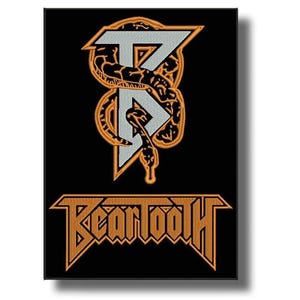 May include: Black patch with the band name "Bear Tooth" in orange, stylized text. Above the name is a design with a snake and the letters "T" and "R" in a silver colour.