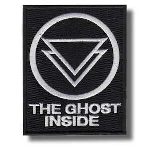 May include: Black rectangular patch with white embroidered design. The design features a circle surrounding two overlapping triangles, with the text "THE GHOST INSIDE" below. The patch has a black border and a white background.