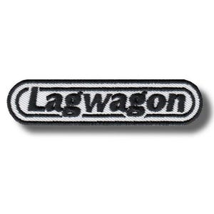 May include: Embroidered patch with the word "Lagwagon" in black, stylized text. The patch has a white background with a black border, and a black shadow effect. The patch is rectangular with rounded corners.