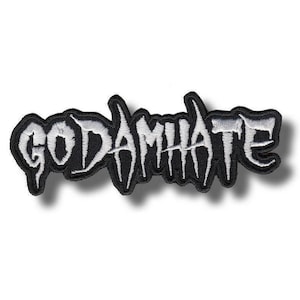 May include: A black and white embroidered patch with the text "GODAMNHATE" in a stylized font. The patch has a black border and the text is in white. The patch is rectangular in shape.
