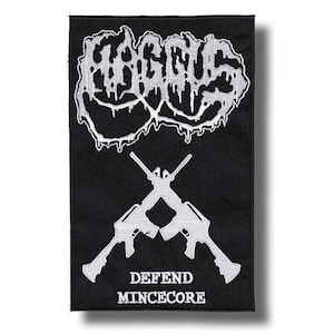 Puede incluir: Parche rectangular negro con texto y gráficos blancos. La parte superior presenta la palabra "GAGUS" en una fuente que gotea. Debajo hay dos rifles cruzados y las palabras "DEFEND MINCECORE".