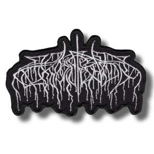 May include: Black embroidered patch with white stylized text. The text appears to be a band logo or emblem, featuring a gothic or metal aesthetic. The patch has a black border and a white background.