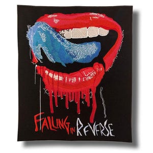 May include: Embroidered patch with a design of a mouth with red lips and a blue tongue. The patch features white teeth and the text "Falling in Reverse" in red and white. The background is black.
