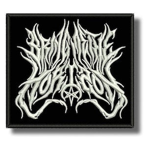 May include: Square embroidered patch featuring the word "BEHEMOTH" in white, gothic lettering, with a pentagram symbol. The patch has a black background and border. The design is detailed and intricate.