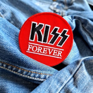 May include: A trio of ceramic mugs with a speckled, matte finish in cream, light grey, and dark grey. Each mug features a simple, minimalist design, ideal for tea or coffee.