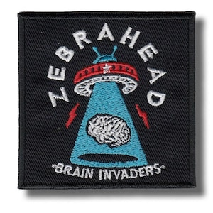 May include: Black square patch with the text "ZEBRAHEAD" arched above a blue UFO with a brain inside. Red lightning bolts flank the UFO. The text "BRAIN INVADERS" is below the UFO.