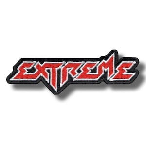 May include: Embroidered patch featuring the word "EXTREME" in red, with a white outline, set against a black backdrop. The patch uses a bold, angular font, suitable for application on garments or accessories.