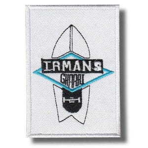 May include: A white rectangular patch with a black and teal graphic design. The design includes the text "IRMANS GHOBAL" in a black font, set within a teal diamond shape. The patch has a stitched border.