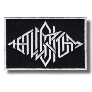 May include: Black rectangular patch with white embroidered text. The text is stylized and geometric, arranged in a diamond shape. The patch has a white border and a shadow.