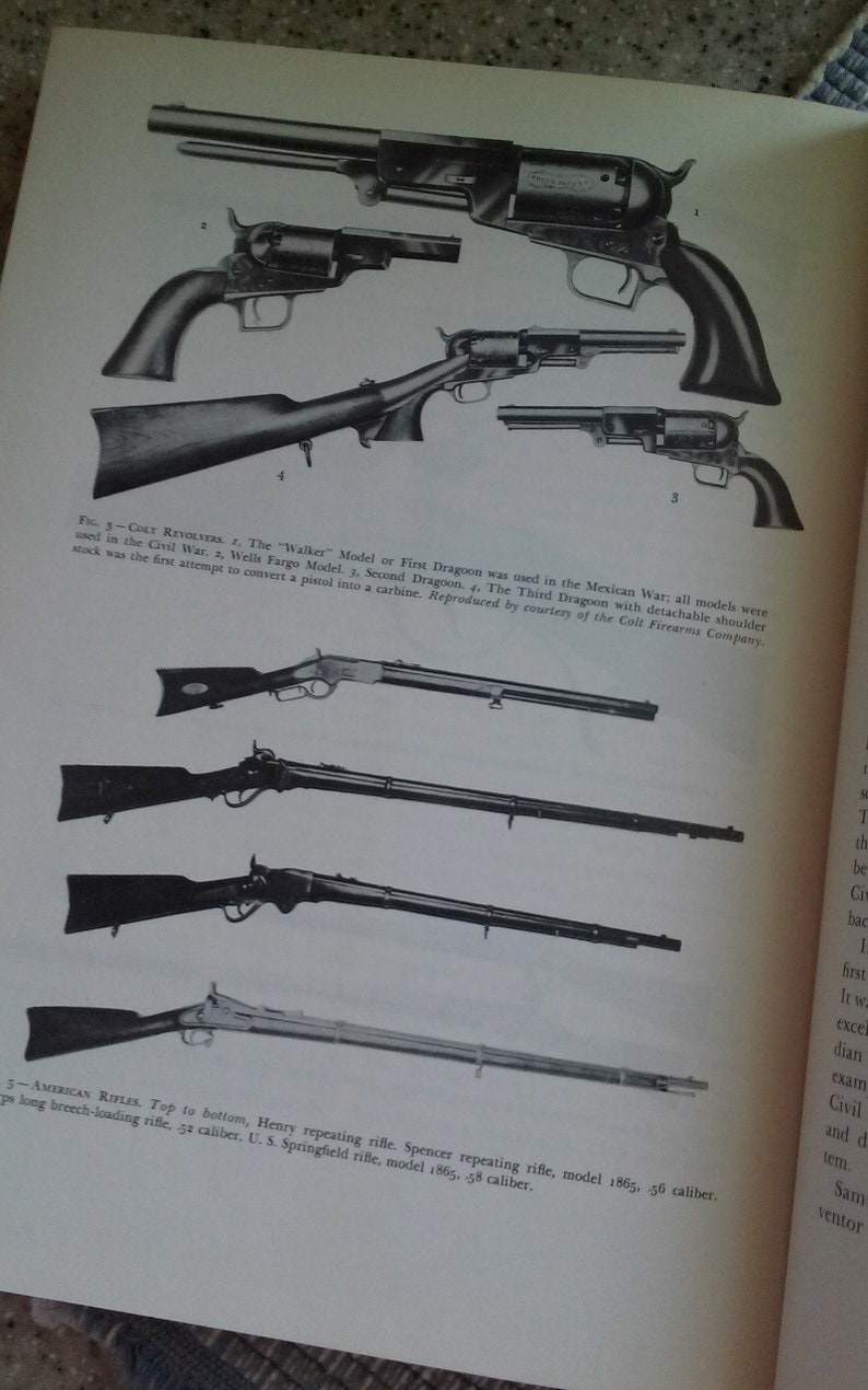 May include: A black and white photo of various firearms, including revolvers and rifles. The caption reads "Colt Revolvers" and "American Rifles".