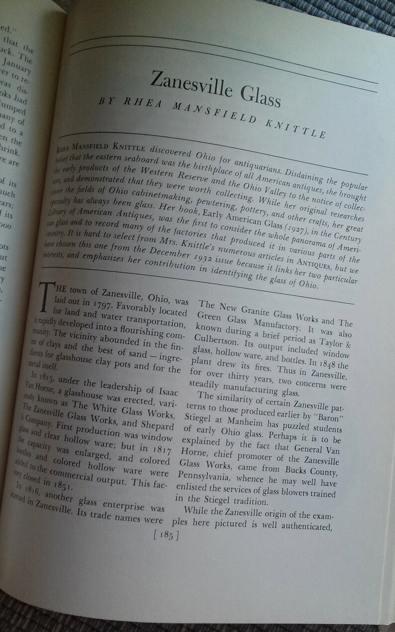 May include: A black and white photo of a page from a book about the history of glassmaking in Zanesville, Ohio. The text discusses the founding of the town and the development of the glass industry. The text mentions the "New Granite Glass Works" and the "Green Glass Manufactory".