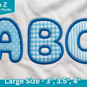 May include: Applique font letters A, B, and C in blue with white patterns. The letter A has a polka dot design, B has a gingham pattern, and C has vertical stripes. The letters are outlined in blue and are labeled as large size 3", 3.5", and 4".