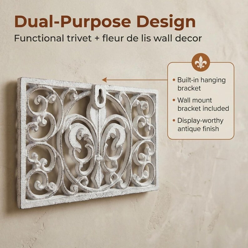 May include: White rectangular wall decor with a fleur-de-lis design and an antique finish. The decor has a built-in hanging bracket and includes a wall mount bracket. The text on the image says "Dual-Purpose Design" and "Functional trivet + fleur de lis wall decor."