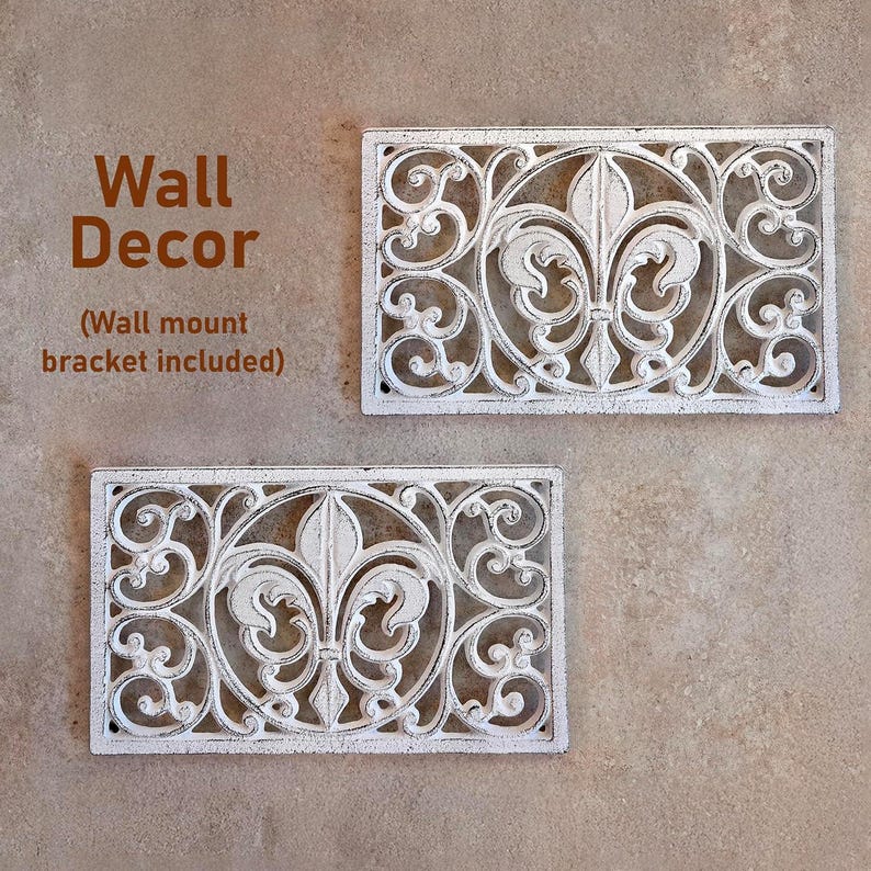 May include: Two white rectangular wall decor pieces with a fleur-de-lis design and scrollwork. The wall decor has a distressed finish and the text "Wall Decor" is visible in the image.