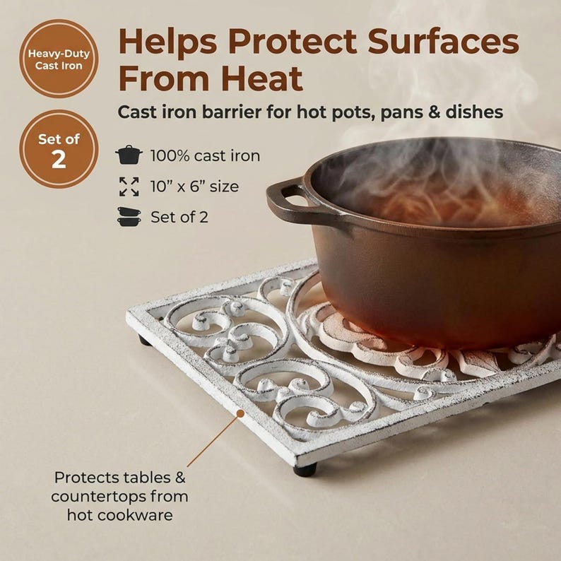 May include: White cast iron trivet with a scrolled design, 10" x 6", protecting a hot pot. The image includes text that reads "Helps Protect Surfaces From Heat" and "Protects tables & countertops from hot cookware."