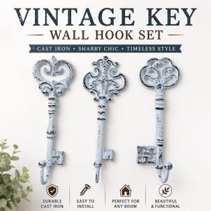 May include: A set of three light blue cast iron wall hooks shaped like antique keys with distressed black detailing. The text VINTAGE KEY WALL HOOK SET is displayed at the top, with additional text including CAST IRON, SHABBY CHIC, TIMELESS STYLE, DURABLE CAST IRON, EASY TO INSTALL, PERFECT FOR ANY ROOM, and BEAUTIFUL & FUNCTIONAL.