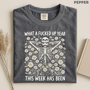 Made for people with a dark sense of humor who love sarcastic graphic tees, skeleton floral aesthetics, burnt out adult humor, and funny relatable designs that mix chaotic energy with cute feminine vibes. Perfect for lovers of dark humor fashion, retro skeleton art, goth floral aesthetics, mentally exhausted humor, and expressive everyday shirts with an unhinged but wearable personality.