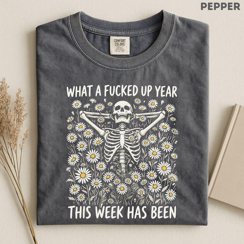 Made for people with a dark sense of humor who love sarcastic graphic tees, skeleton floral aesthetics, burnt out adult humor, and funny relatable designs that mix chaotic energy with cute feminine vibes. Perfect for lovers of dark humor fashion, retro skeleton art, goth floral aesthetics, mentally exhausted humor, and expressive everyday shirts with an unhinged but wearable personality.