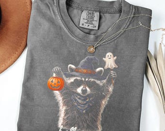 アライグマのハロウィンシャツ、不気味な季節のシャツ、かわいいハロウィンTシャツ、レトロなハロウィンシャツ、秋のグラフィックTシャツ、トリックオアトリートシャツ