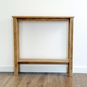 Modern oak sofa table with storage shelf