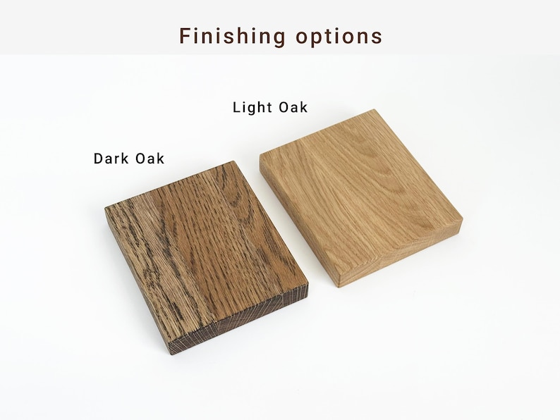 May include: Two rectangular wooden blocks, one in dark oak and the other in light oak, are displayed against a white background. The text "Finishing options" and "Dark Oak" and "Light Oak" are visible.