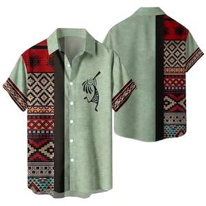 May include: A short-sleeved shirt with a light green background and a black vertical stripe. The shirt features a Kokopelli figure and geometric patterns in red, black, and brown. The shirt has a collared neckline.