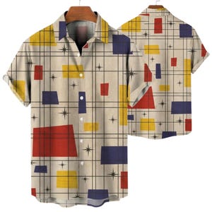 May include: A short-sleeved button-down shirt with a retro geometric pattern. The shirt features a beige background with a grid of black lines and colorful shapes in red, yellow, and blue. The design includes starburst accents.