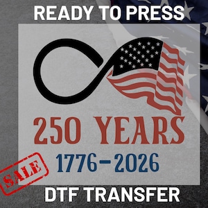 May include: DTF transfer design with an infinity symbol and the American flag. The design includes the text "READY TO PRESS", "250 YEARS 1776-2026", and a "SALE" stamp. The background is a grey surface with a partial American flag.
