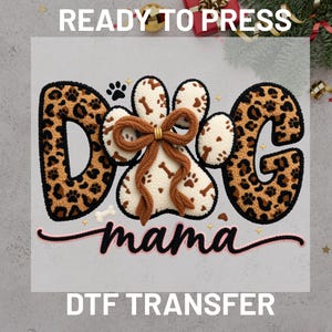 May include: A white ceramic mug with a black handle and the text "But First, Coffee" in a black, handwritten-style font. The mug is on a white surface.