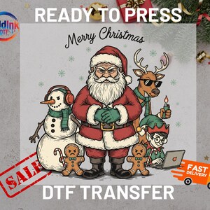 May include: A DTF transfer featuring a cartoon Santa Claus, snowman, reindeer, and elf with the text "Merry Christmas." The design includes gingerbread men and snowflakes. The words "Ready to Press" and "DTF Transfer" are also visible.