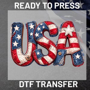 May include: DTF transfer with the word "USA" in a patriotic design. The letters are red, white, and blue with a denim and patchwork style, featuring stars and stripes. The text "READY TO PRESS" is above the letters.