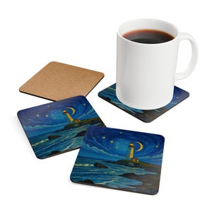 May include: A white ceramic mug filled with coffee sits on a coaster featuring a lighthouse scene under a starry night sky. Additional coasters with the same design are visible, along with a plain cork coaster. The coasters are square and the mug is white.