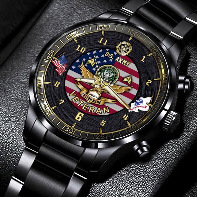 May include: A black stainless steel wristwatch featuring a dial with a United States flag background, a golden eagle emblem, and the text U.S. ARMY and VETERAN. The watch includes gold-toned hands, gold hour markers, and a black metal link band.