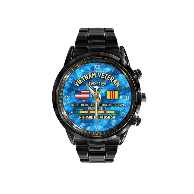 May include: Black wristwatch with a blue marble-effect face. The watch face features the text "Vietnam Veteran 1965-1966" and the American and Vietnamese flags. The watch also has the text "Been there - Do that and damn proud of it."