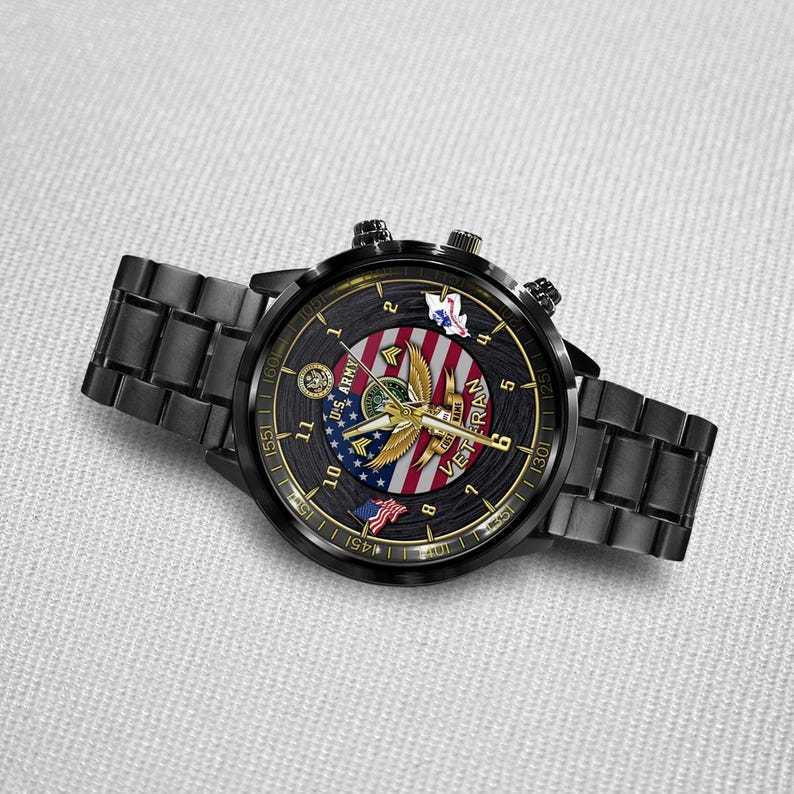 May include: A black metal wristwatch with a round face featuring a U.S. Army emblem, a gold eagle graphic, and a red, white, and blue striped background. The dial includes the text U.S. ARMY and VETERAN, with gold hands and numerical hour markers.