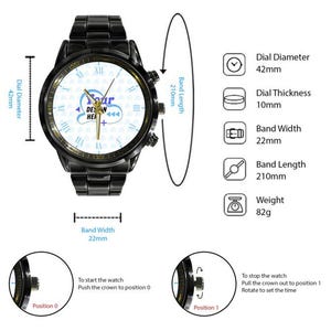 May include: A black metal wristwatch with a white dial featuring the text "YOUR DESIGN HERE" and gold hands. Specifications include a 42mm dial diameter, 10mm thickness, 22mm band width, 210mm band length, and 82g weight. Crown positions 0 and 1 are shown.