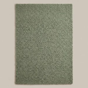 Handwoven chunky knit wool rug in neutral green tone, modern Scandinavian floor rug for warm and cozy interiors