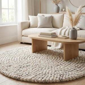 Modern chunky knit wool rug with textured pebble design, neutral round wool rug ideal for nursery, bedroom, or cozy reading corner