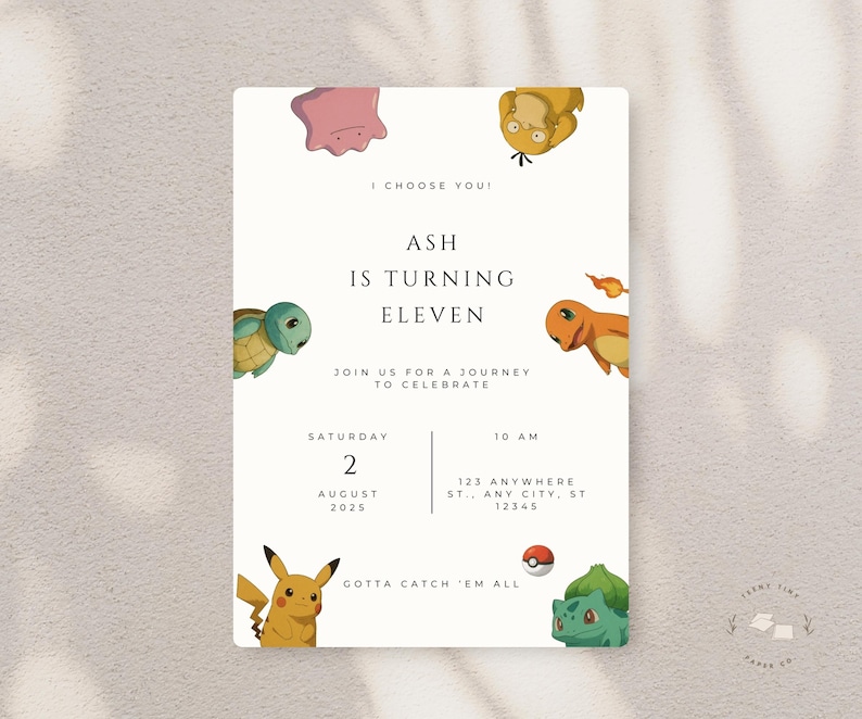 May include: A cream-colored invitation with the text "I Choose You!" and "Ash is turning eleven." Features cartoon characters and the words "Gotta Catch 'Em All." Includes date, time, and location details.