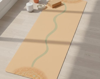 May include: A beige yoga mat with a light green wavy line down the center and decorative mandala patterns at each end. A wooden yoga block, a small potted plant, and a white essential oil diffuser are nearby.