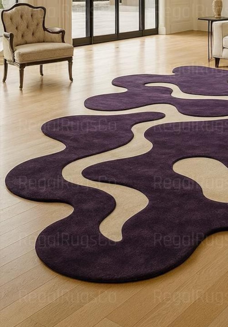 Modern Purple Abstract Wavy Rug in deep plum and beige tones, featuring curved organic shapes. Large 12x15ft contemporary area carpet perfect for living rooms or bedrooms, adding artistic style, warmth, and sophistication to any modern home interior.