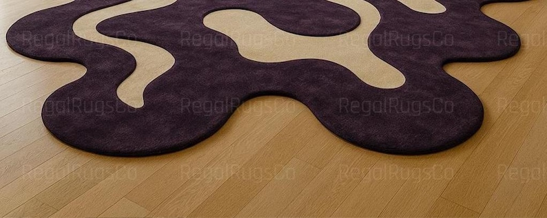 Modern Purple Abstract Wavy Rug in deep plum and beige tones, featuring curved organic shapes. Large 12x15ft contemporary area carpet perfect for living rooms or bedrooms, adding artistic style, warmth, and sophistication to any modern home interior.