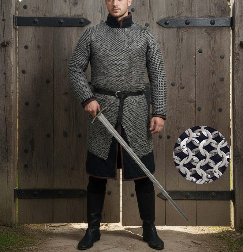 May include: A full-length image of a medieval chainmail shirt and pants, with a long sword. The chainmail is silver and black, with a black belt and boots. The background is a wooden door.