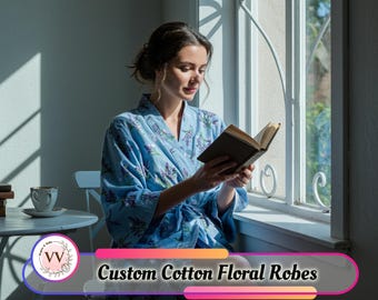 May include: A light blue cotton robe with a floral pattern. The robe is worn by a person reading a book near a window. The text "Custom Cotton Floral Robes" is displayed at the bottom of the image.